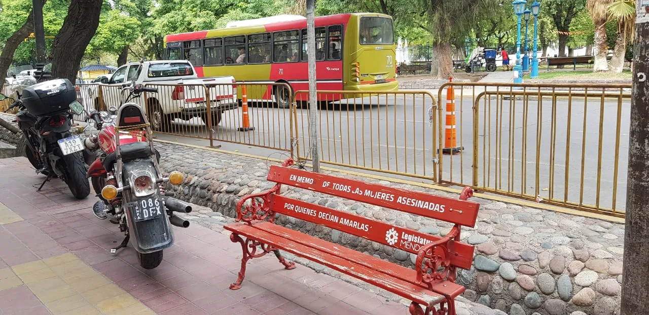 View of the Red Bench located at the intersection of Patricias Mendocinas and Sarmiento Streets, in the city of Mendoza, Argentina, in front of the Provincial Legislature and facing away from Plaza In